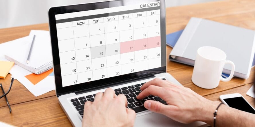 Faceless man typing into a calendar - how long should you study - creating a PE exam study schedule - insights from Petro Publications.